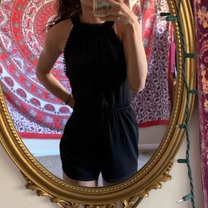 black Pom Pom frilled romper.